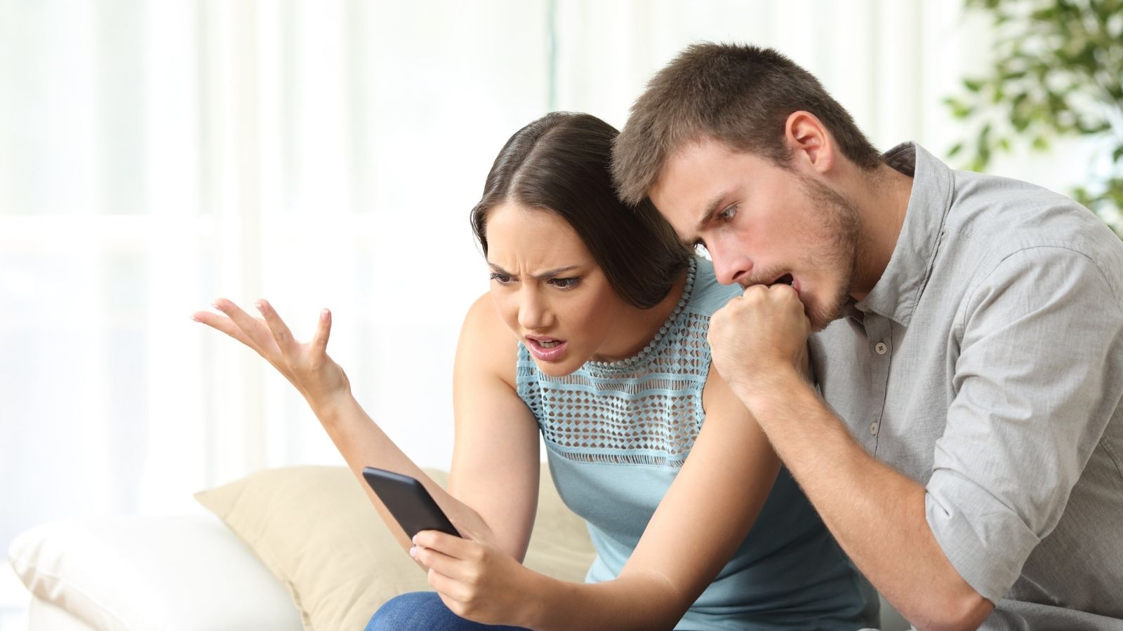 frustrated couple talking on the phone
