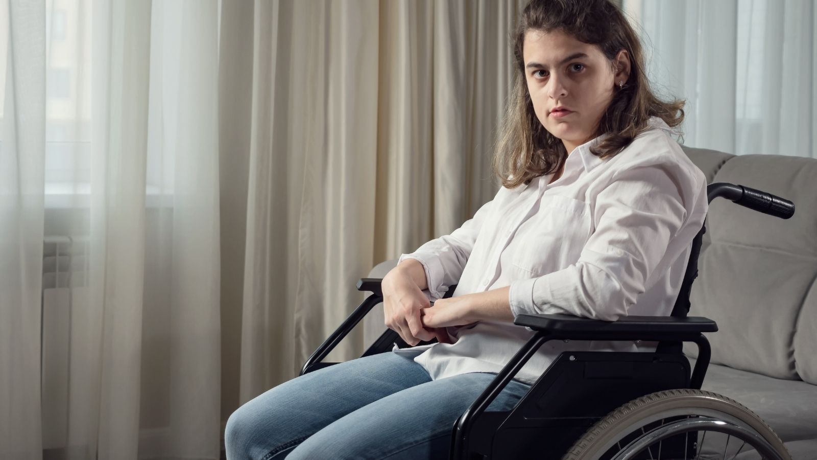 sad disabled woman in a wheelchair