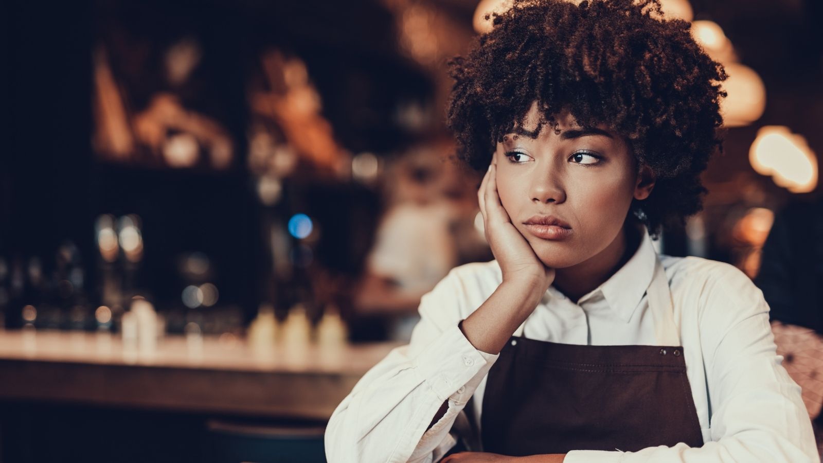 Customers Stayed At Her Table Well Past Closing Time, And She Was Desperate To Go Home waitress looking bored and frustrated
