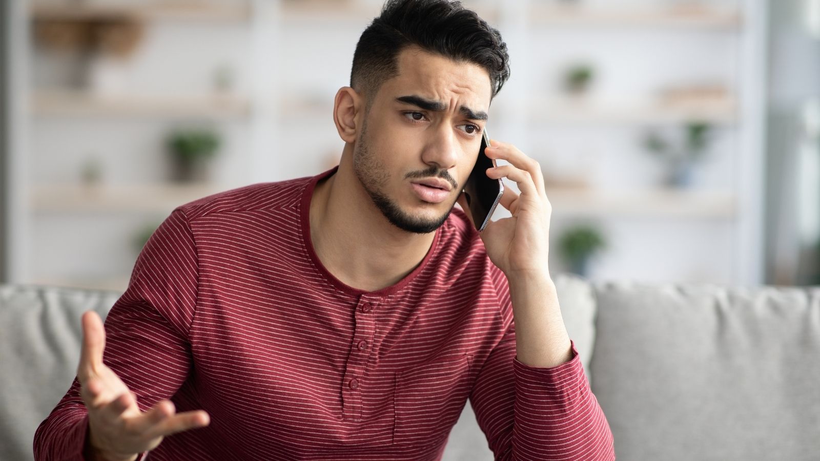 upset man talking on the phone
