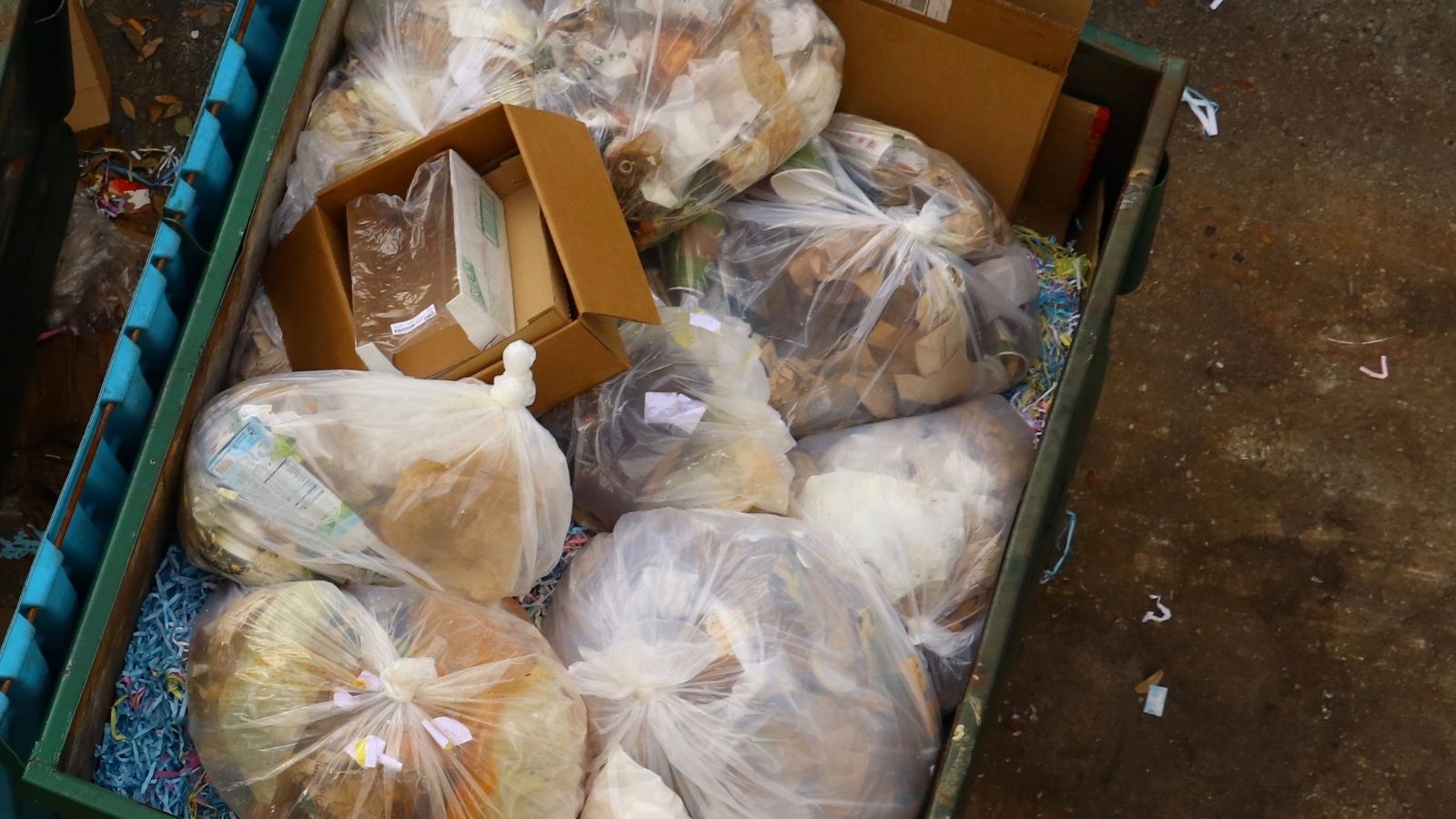 A Restaurant Worker Was Told To Change The Dates On Expiring Products, But Corporate Said To Stop Doing That bags of food in a dumpster
