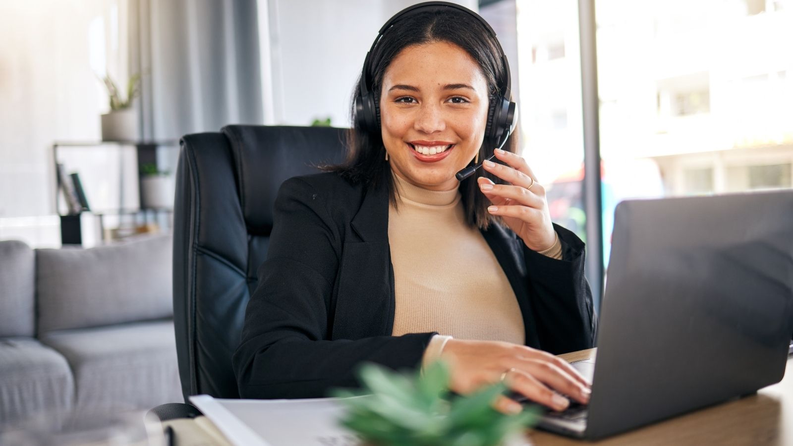 A System Outage Severed Her Queue—Only for Her Boss to Demand Unpaid Overtime Recovery smiling woman working from home