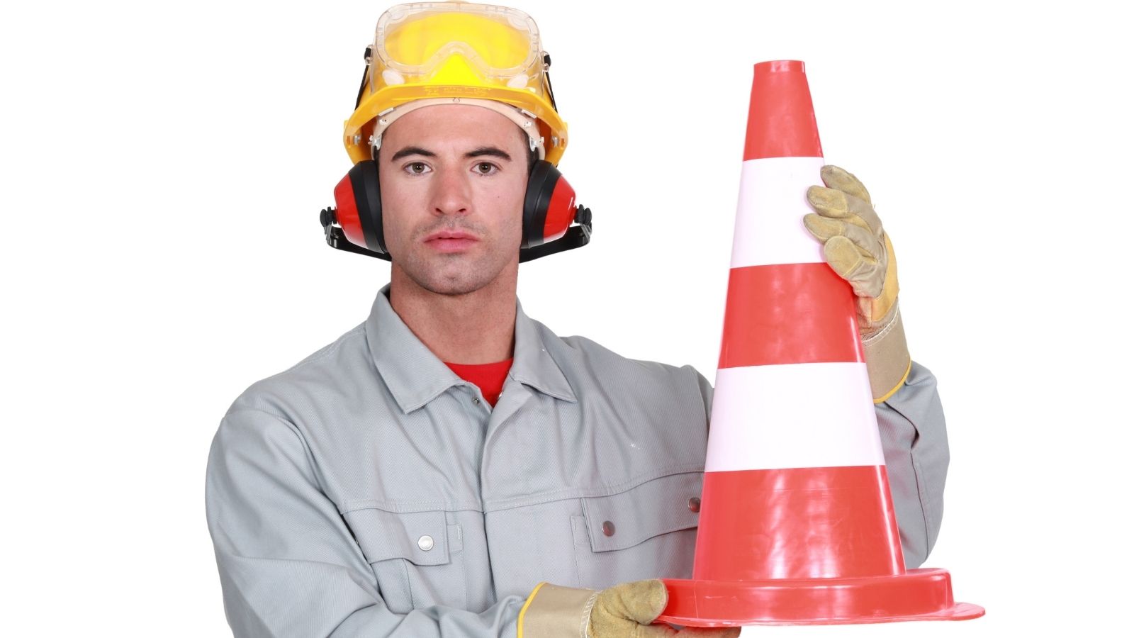 man in a hardhat holding a traffic cone