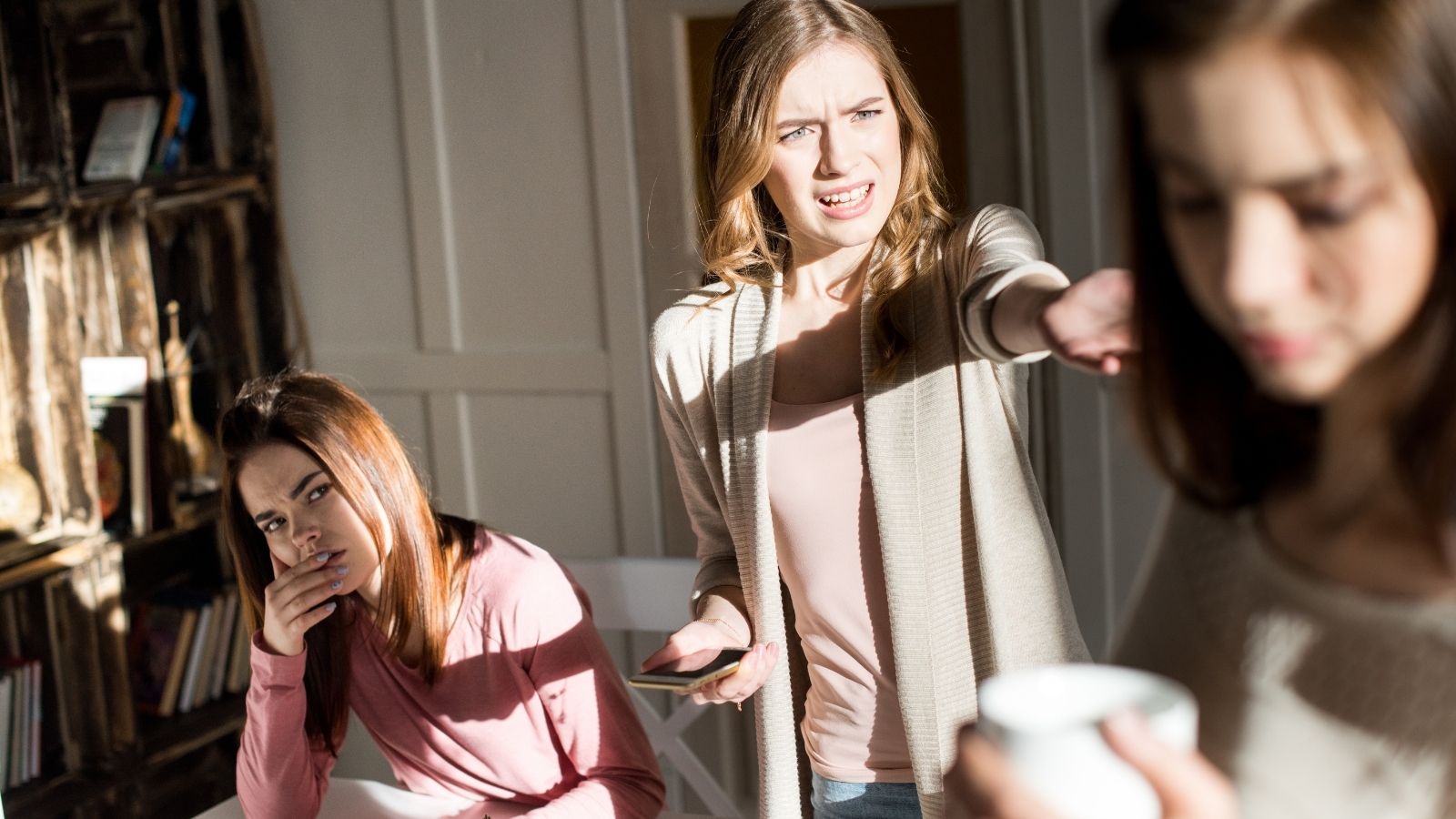 College Roommates Agreed On Rent And Parking Spots, But One Wants To Change The Deal As Graduation Approaches three young women arguing