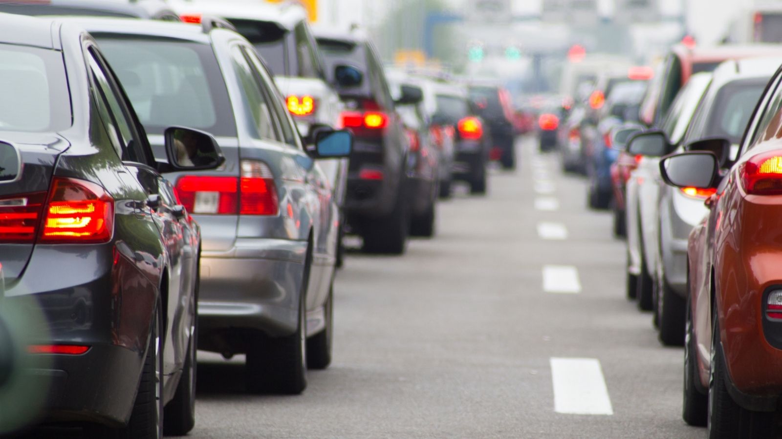 Driver Is Furious When Two Other Drivers Drive Side By Side Holding Up Traffic, So She Calls One Of Them cars stuck in traffic