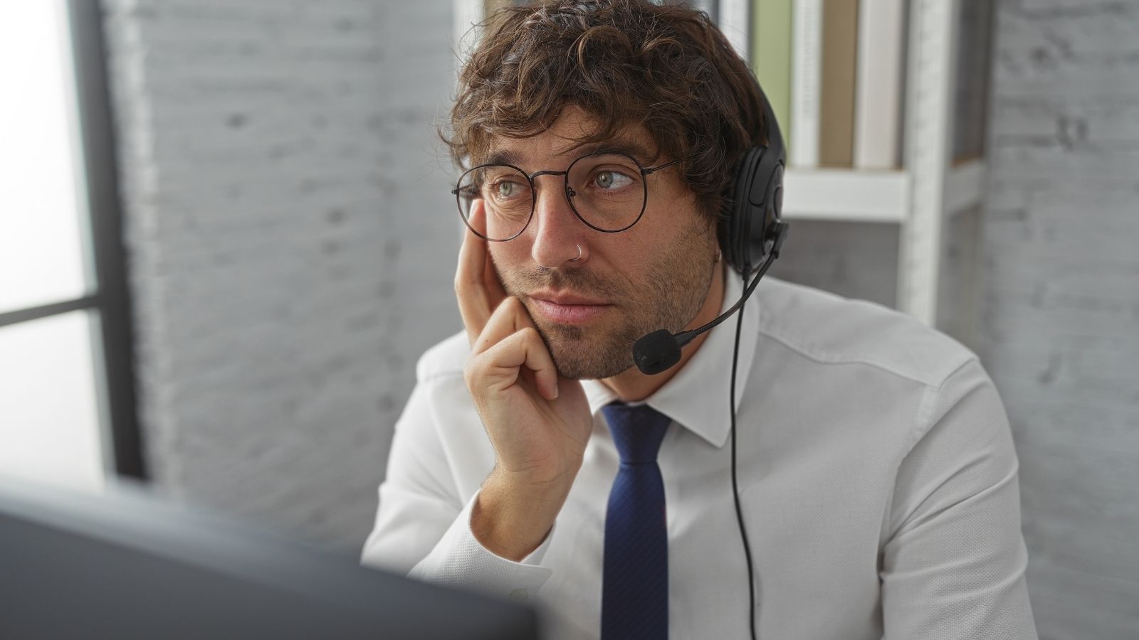 They Sent Cheap Ballpoints to London—Until a UK Analyst Exploited Procurement Conversion Ratios man wearing wired headset