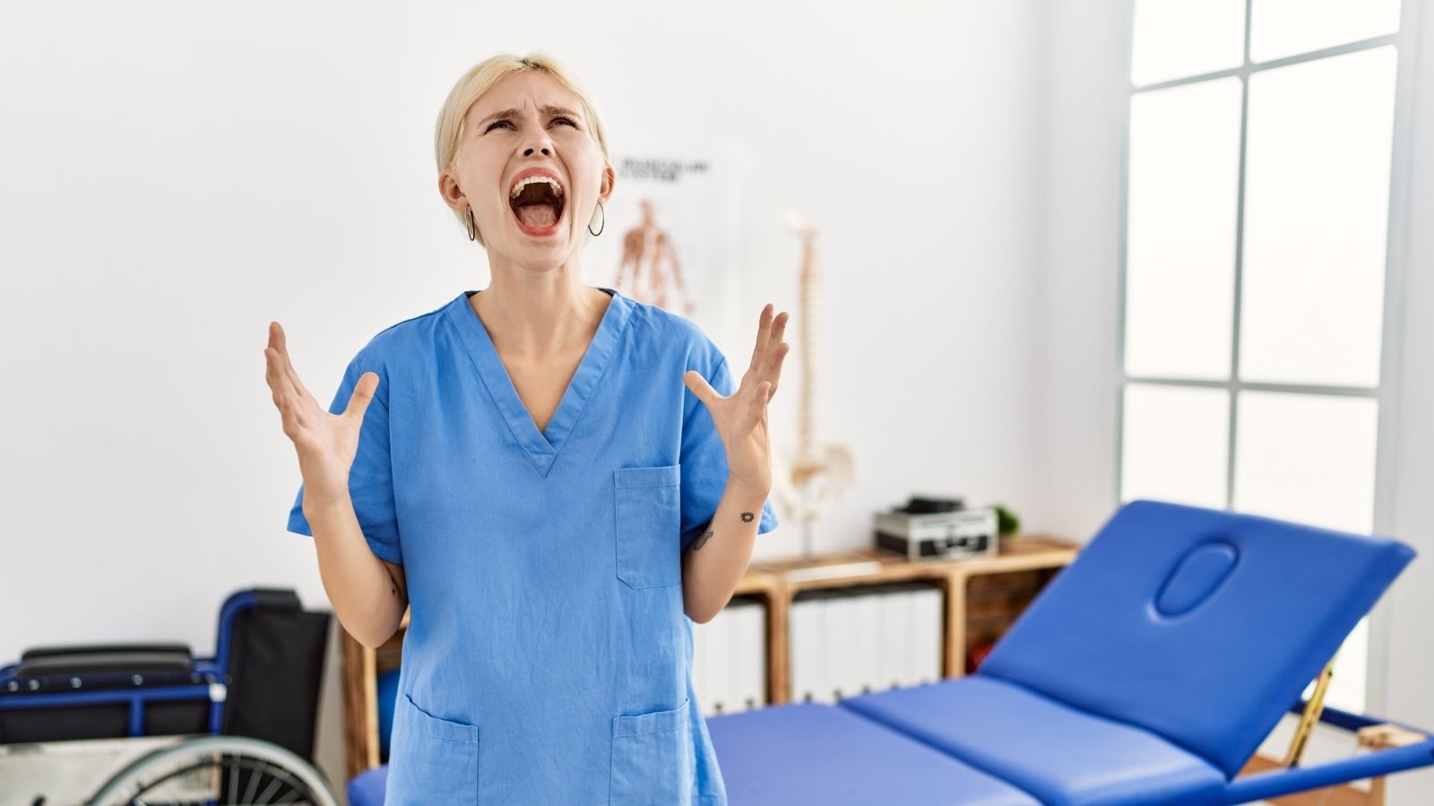 A Clinic Shares A Parking Lot With An Erratic Salon Owner, And Her Behavior Has Them Wishing They Could Just Relocate woman wearing scrubs screaming