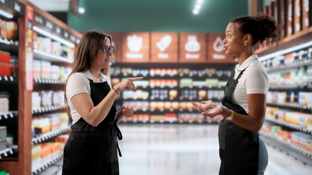 grocery store employee talking to manager