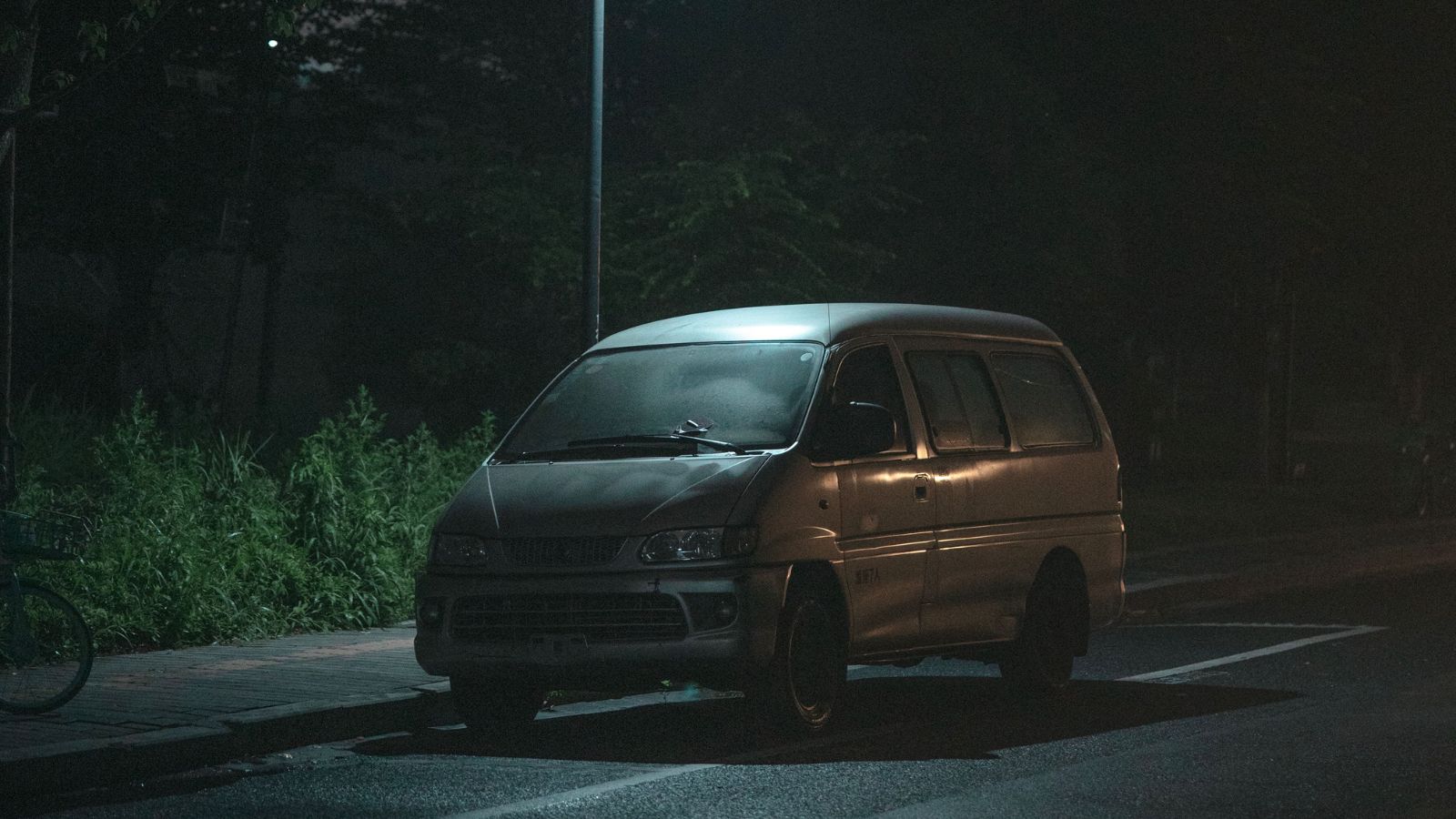 Van parked on the street in the middle of the night