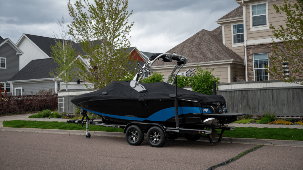 He Parked His Boat in the Driveway Only One Night a Week—Until an HOA Complaint Drove Him to Build Out of Reach Custom Storage boat parked near suburban street