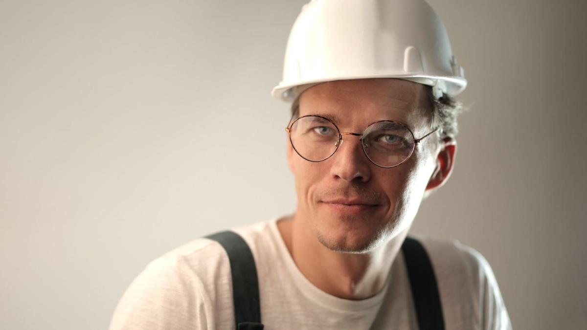 He Covered Two Managers PTO On Top Of His Own Job — And Proved The Plant Ran Just Fine Without Them confused foreman in circular glasses