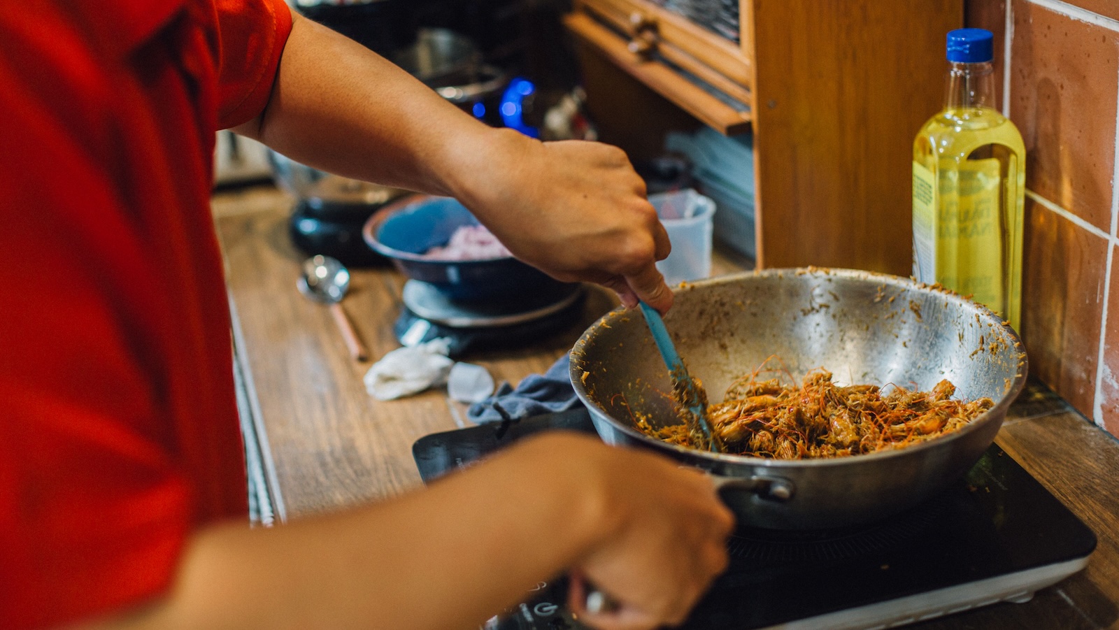 person cooking a meal on the stove