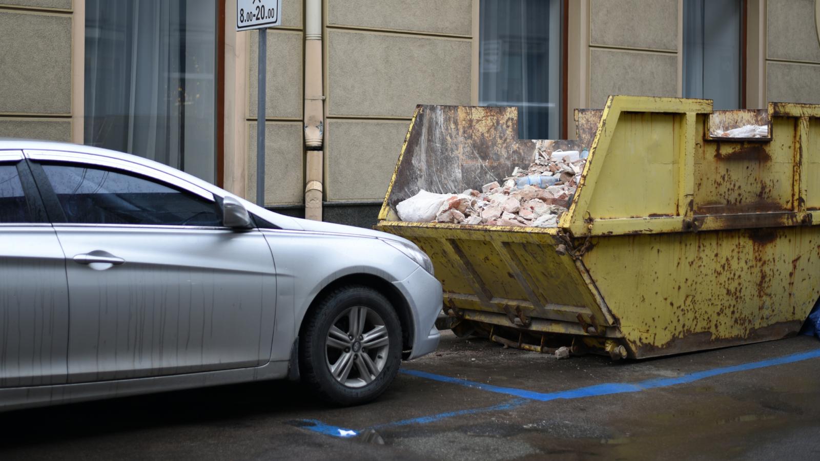His Neighbors Friends Keep Parking In A Way That Blocks The Trash Truck, So His Garbage Never Gets Picked Up car parked by a dumpster