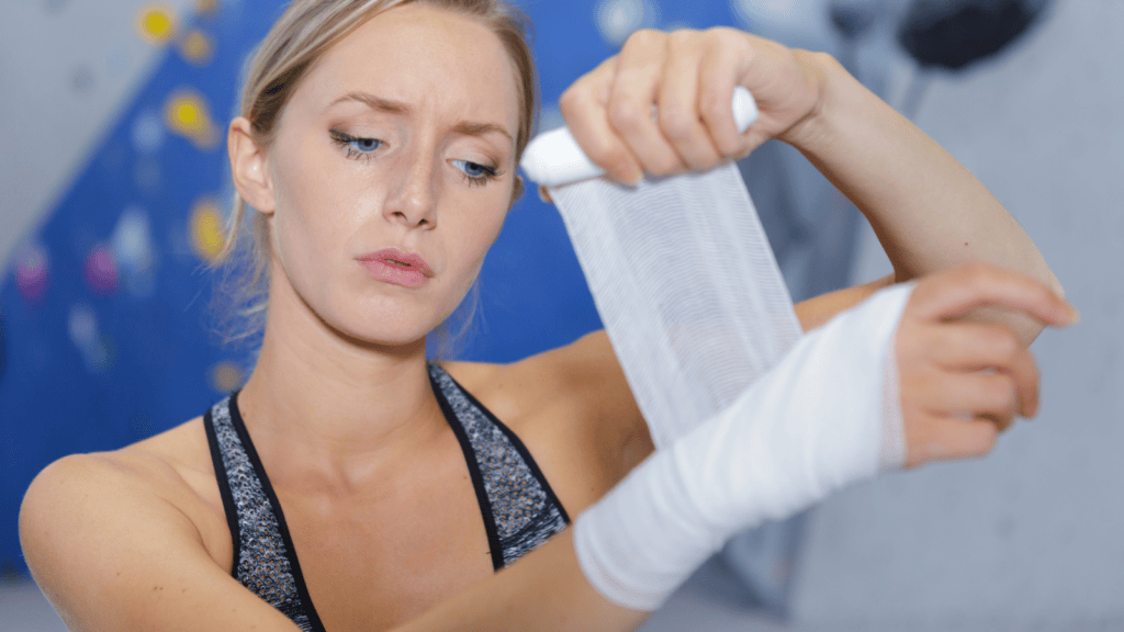 female gymnast taping her wrists