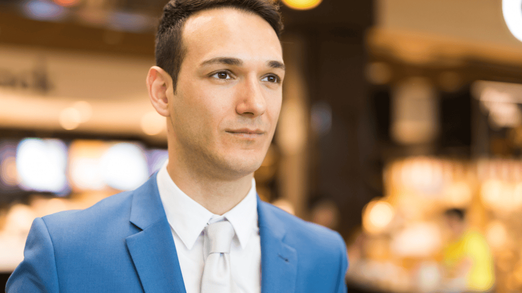 man in suit in grocery store