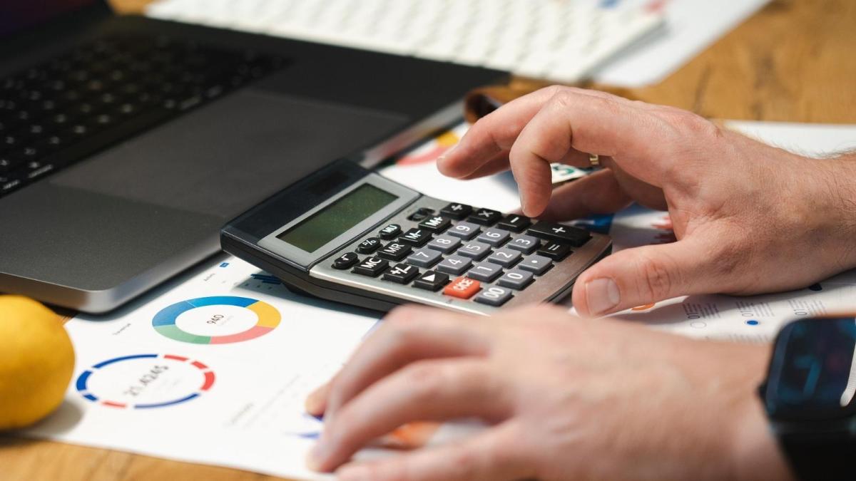 Man Asked His Father To Take His Jobless Sister Off The Estate, So More Money Could Go To Siblings Raising Children man using a calculator