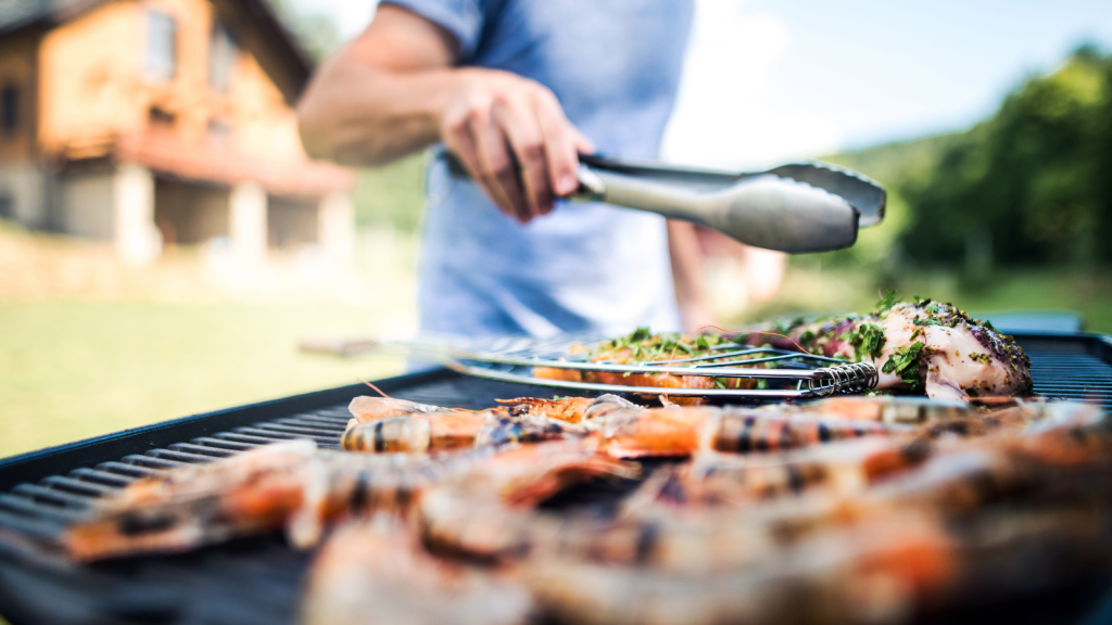 man with bbq grill