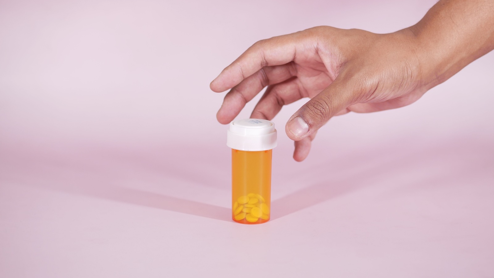 She Wont Supervise Her Friends Medication Given Her History Of Overdosing, But Her Friend Says That Could Cost Her Her Spot At School person reaching for medicine bottle