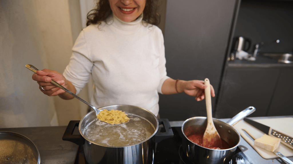 Dinner Plans Turned Into A Family Blowup After A College Student Tried To Set Aside Some Pasta For Later And Her Sister Took Serious Offense mother cooking a lot of pasta with pots