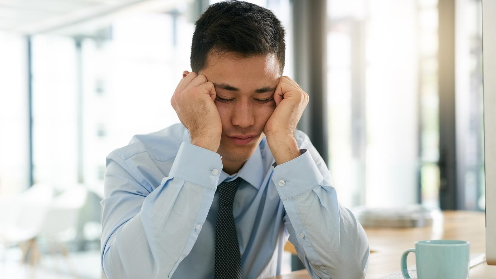Recent College Graduate Started Their First Real Job, But Theyre Already Burned Out man with his head in his hands