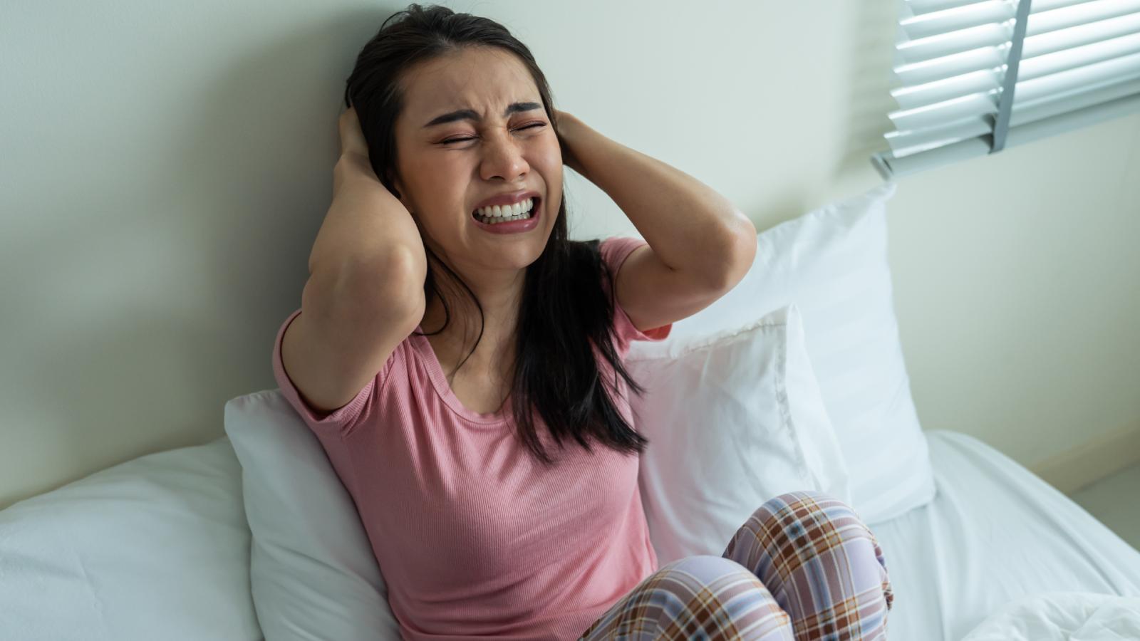 She Came Home to 6 People in Her Living Room—Until She Claimed Her Space Back woman upset on her bed