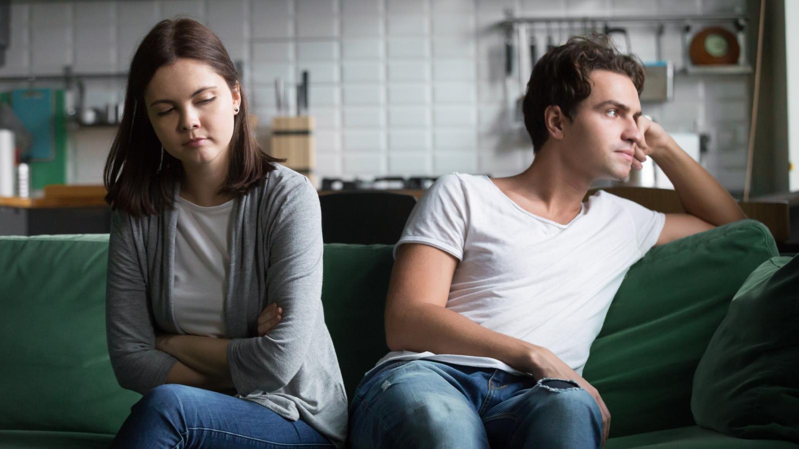 A Former Neighbor Refused to Move On—Escalating from Midnight Stalking to Deliberate Car Vandalism couple worried on a couch
