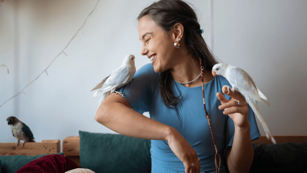 She Tried Keeping Her Pets Separate From Visiting Children, Yet The Kids Ignored The Closed Room And Learned The Hard Way Why It Was Off Limits parrots on woman's arm