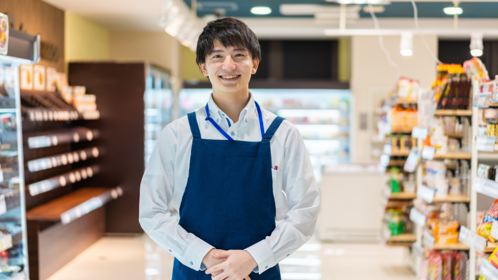 smiling male convenience store employee