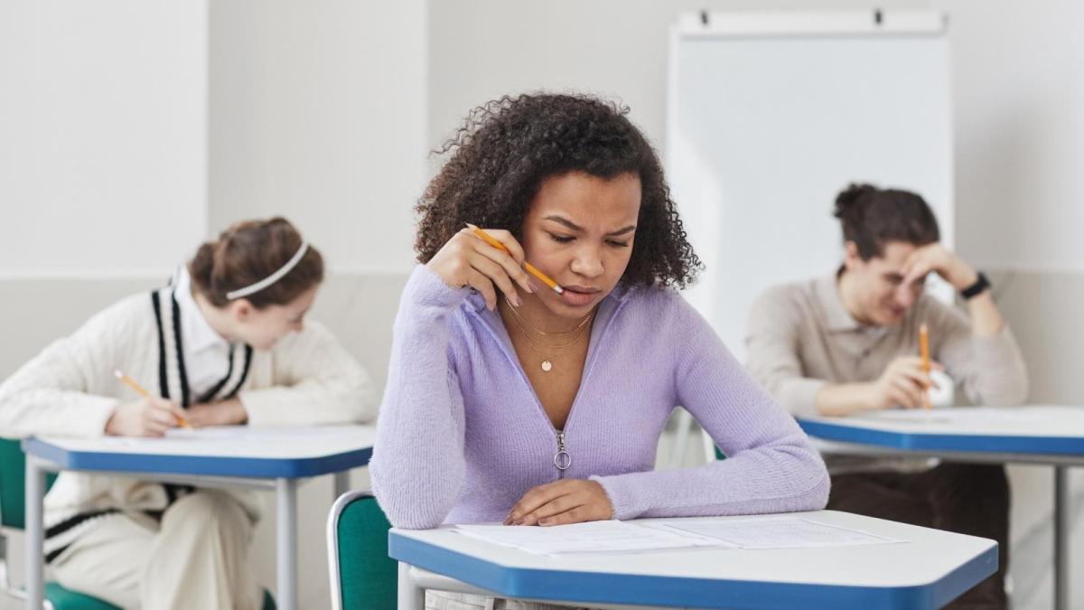 stressed high school girl in purple sweater