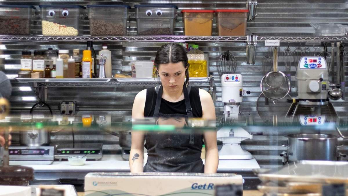 She Kept Getting Pulled From The Kitchen To Cover Serving Shifts — So She Refused A Last Minute Double When Her Boss Called stressed woman standing in kitchen