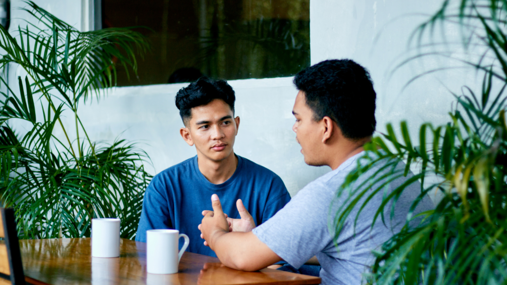 two older brother having a serious conversation