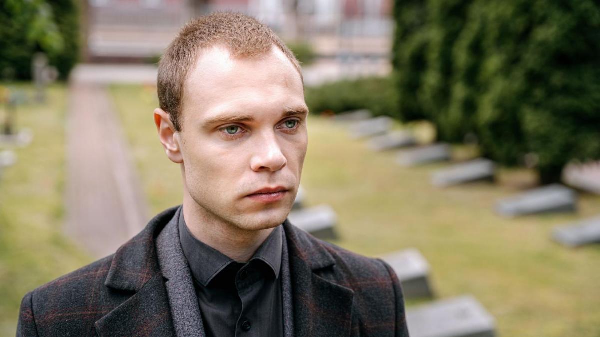 His Lifelong Friend Promised Hed Be There For His Grandmothers Burial, But Then Ghosted Him Completely upset man standing in graveyard