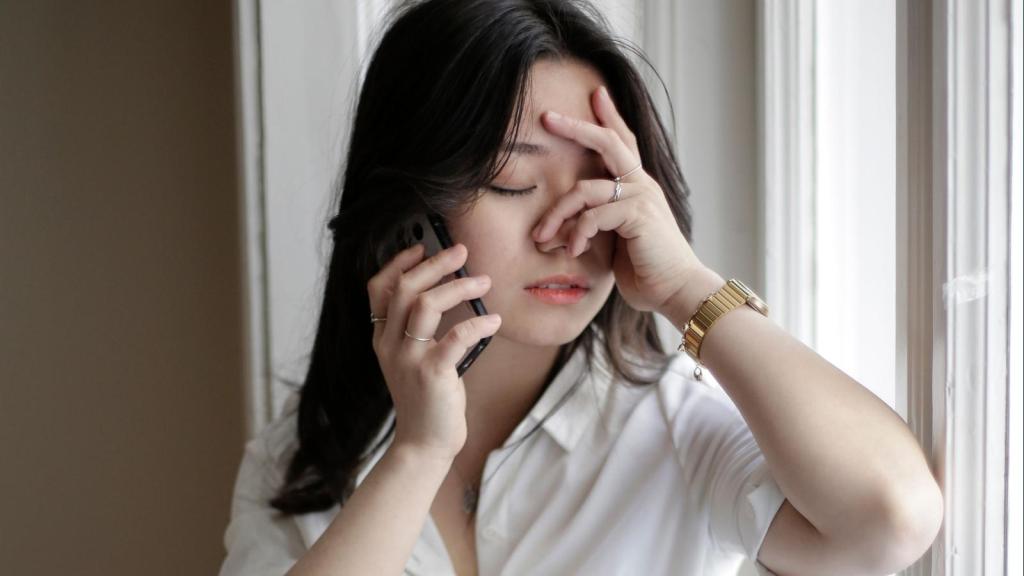 upset woman talking on the phone