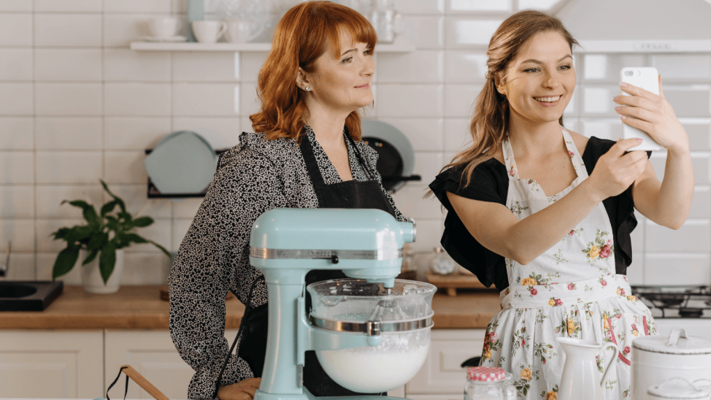 She Went Out Of Her Way For A Customer During The Holiday Rush, But Felt Used When Her Effort Wasnt Appreciated woman baking in her kitchen holding phone