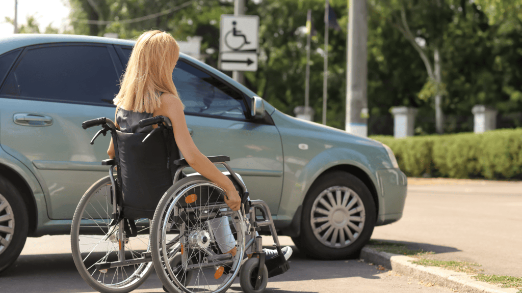 He Got Tired Of Seeing The Same Truck Take Over Handicap Parking, And Repeated Reports Eventually Led To A Costly String Of Citations woman in wheelchair next to handicapped parking