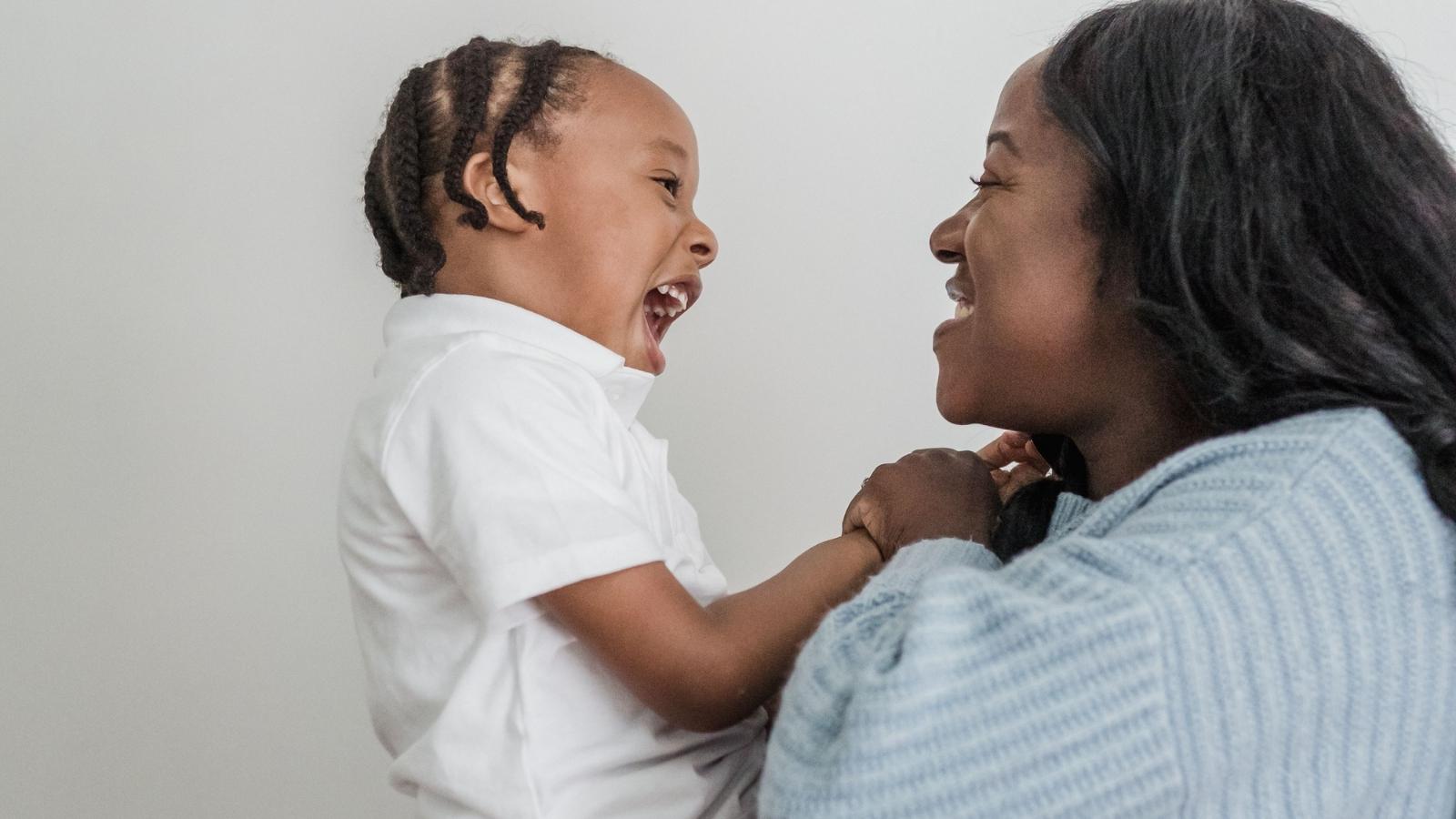 woman smiling at her son
