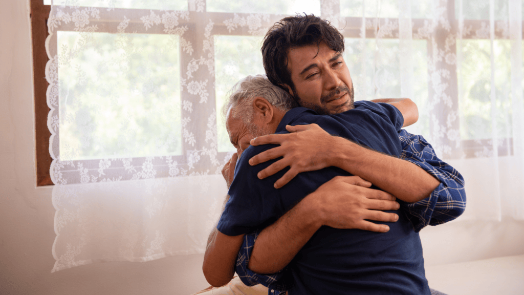 The Rest Of The Family Forgave His Older Brother, Yet He Still Wont Let Him Back In young man hugging his sick elderly dad
